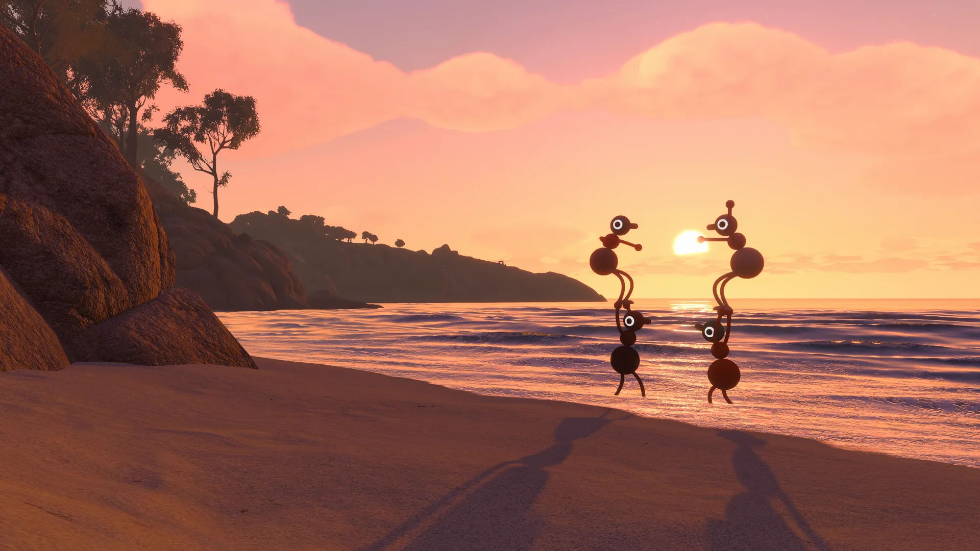 Two friends wading into the sea at sunset.