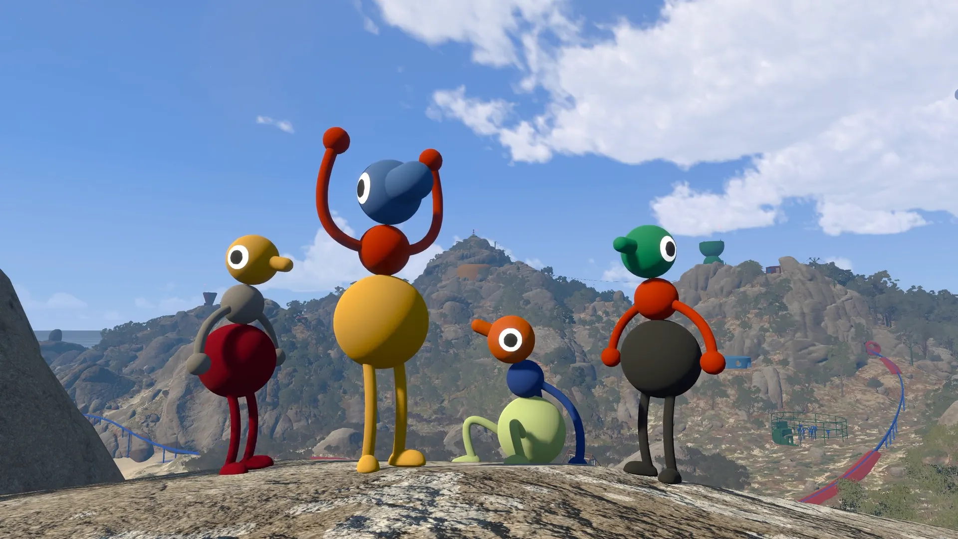 Four differently coloured friends gathering on a mountain ridge.